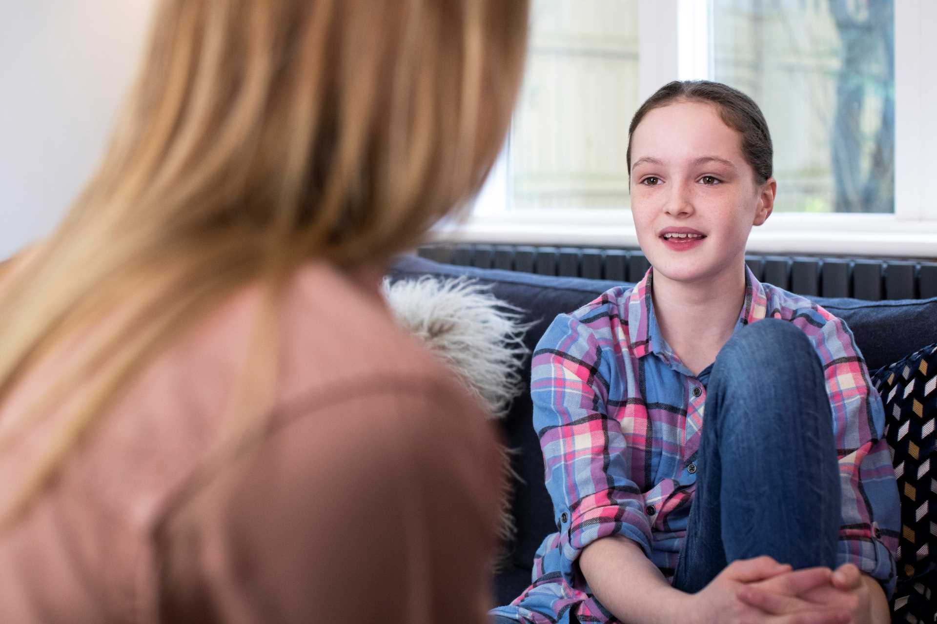 Mother Having Serious Conversation With Young Daughter At Home